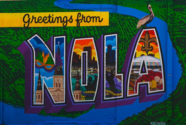 Colorful mural on a wall that says greetings from New Orleans